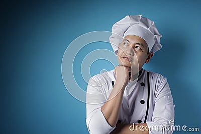 Male Asian Chef Thinking Something Stock Photo