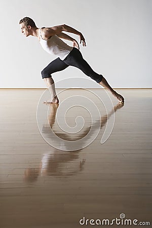 Male Ballet Dancer Practicing In Rehearsal Room Stock Photo