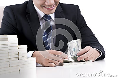 Male banker is counting banknotes on white background Stock Photo