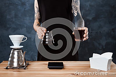 Male barista brewing coffee. Alternative method pour over. Stock Photo