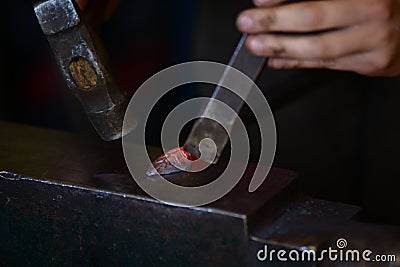 Male blacksmith in his smithy workshop Stock Photo