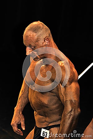 Male bodybuilding contestant showing his best Editorial Stock Photo