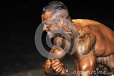 Male bodybuilding contestant showing his best Editorial Stock Photo