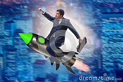 The male businessman flying on rocket in business concept Stock Photo