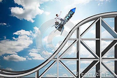 The male businessman flying on rocket in business concept Stock Photo