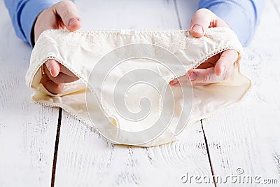 Male buyer chooses to buy female lingerie Stock Photo