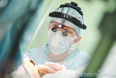 Male cardiac surgeon at child cardiosurgery operating room Stock Photo