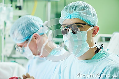 Male cardiac surgeon at child cardiosurgery operating room Stock Photo