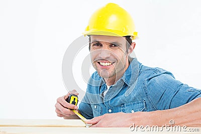 Male carpenter using measue tape Stock Photo