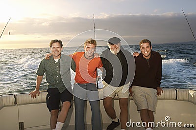 Male Caucasian Friends On Yacht Stock Photo