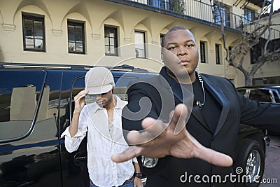 Male Celebrity And Bodyguard Stock Photo