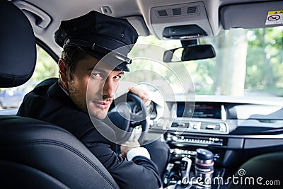Male chauffeur sitting in a car Stock Photo