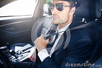 Male chauffeur sitting in a car Stock Photo