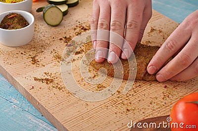 Male chef cooking spicy chicken Stock Photo