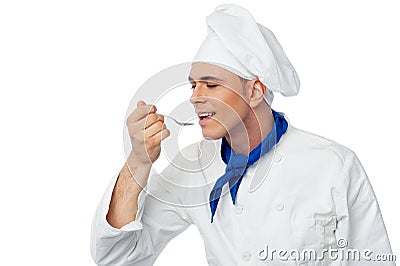 Male chef tasting the food Stock Photo