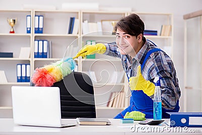 The male cleaner working in the office Stock Photo