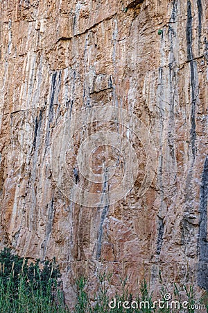 Male climber hanging by a vertical rock Stock Photo