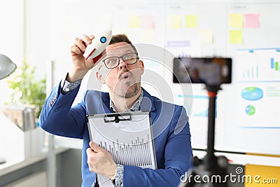 Male coach conducts online training on launching startup Stock Photo