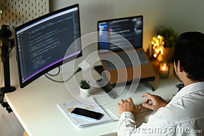 Male coders developing website design and coding technologies at modern office Stock Photo