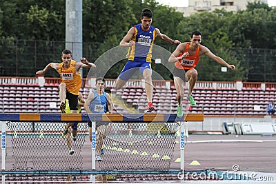 Male competitors at 3000m steeplechase Editorial Stock Photo