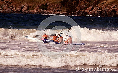 Male competitors on Surf Skis competing in a Surf Livesaving competition Editorial Stock Photo
