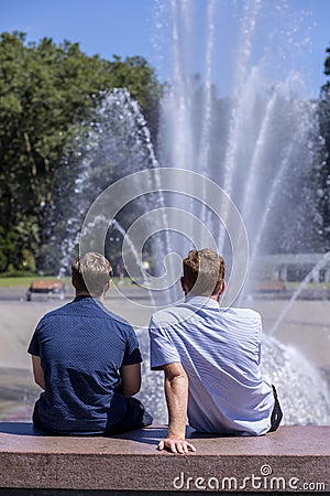 Male Couple on a Sunny Day at the Seattle Center Editorial Stock Photo