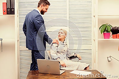 Male coworker touching girl. Share assault story. Defend yourself. First signs. Unacceptable touches. Discrimination Stock Photo