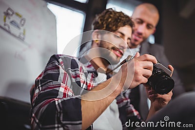 Male coworkers looking in camera at creative office Stock Photo