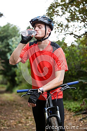 Male cyclist drinking water Stock Photo