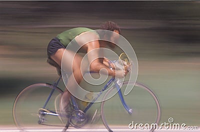 Male cyclist riding fast Editorial Stock Photo