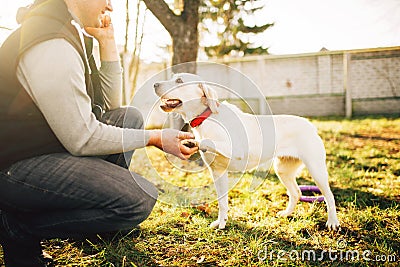 Male cynologist with trained working dog Stock Photo