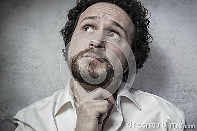 Male decisionmaking, man in white shirt with funny expressions Stock Photo