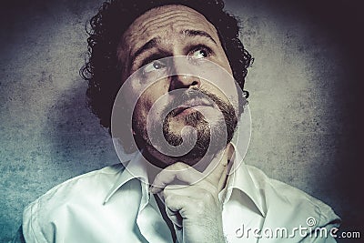 Male decisionmaking, man in white shirt with funny expressions Stock Photo