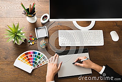 Male Designer Using Digital Graphic Tablet Stock Photo