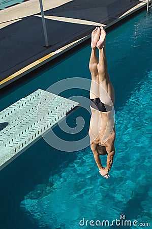 Male Diving Upside Down Stock Photo