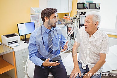 Male doctor examining a patient Stock Photo