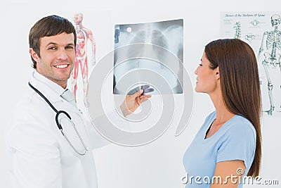Male doctor explaining lungs xray to female patient Stock Photo