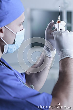 Male doctor with injection Stock Photo