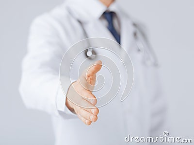 Male doctor with open hand ready for hugging Stock Photo