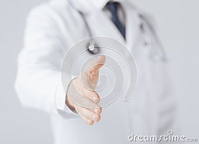 Male doctor with open hand ready for hugging Stock Photo