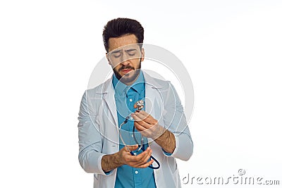 male doctor otoscope hospital treatment therapist light background Stock Photo