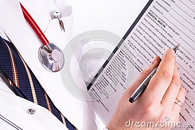 Male doctor ready to write patient information Stock Photo