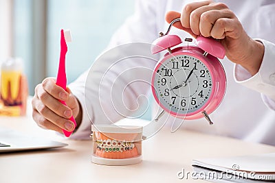 The male doctor stomatologist working in the clinic Stock Photo