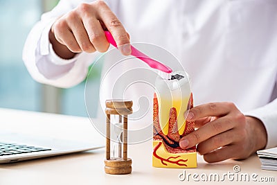 The male doctor stomatologist working in the clinic Stock Photo