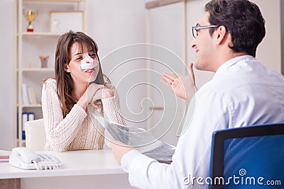 The male doctor talking to patient with nose operation surgery Stock Photo