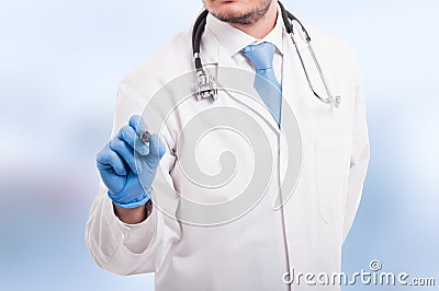 Male doctor writing something with marker Stock Photo