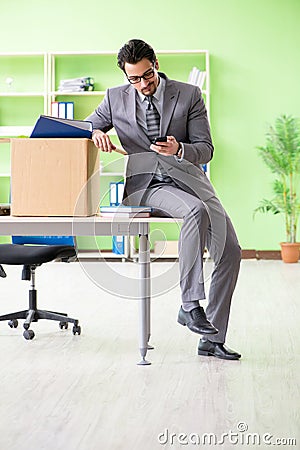 The male employee collecting his stuff after redundancy Stock Photo