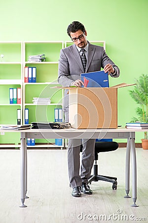 The male employee collecting his stuff after redundancy Stock Photo