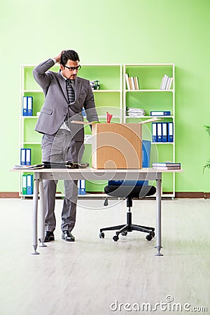 The male employee collecting his stuff after redundancy Stock Photo