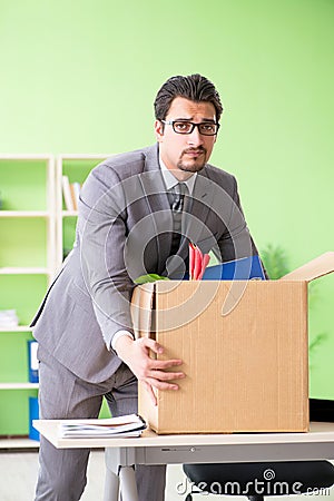 The male employee collecting his stuff after redundancy Stock Photo